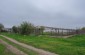 Location of the former Soviet border guards’ barracks. The original buildings were destroyed. Today there are farm buildings instead. ©Les Kasyanov/Yahad-In Unum