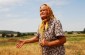 Lidia H., born in 1925, showing the Yahad team the killing site of three Jewish girls, Anna, Rita, and Inna, near the former location of the warehouse. ©Les Kasyanov/Yahad - In Unum