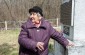 Rita Sh.,born in 1936, a Jewish survivor of the Pechera camp, at the memorial where the majority fo her family was buried. ©Les Kasyanov/Yahad - In Unum.