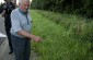 Zdzislaw U., born in 1928, showing the team the execution site next to the main road in Rudka, where a Jewish man was shot by a German gendarme in summer 1942 as a column of Jews passed through the town. ©Olga Szymerowska/Yahad - In Unum