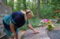 Yevdokia M., born in 1937, on the mass grave of the Soviet POWs. ©Les Kasyanov/Yahad-In Unum