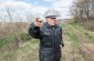 Volodymyr S., born in 1926, at the location of the mass grave where he was requisitioned to transport the bodies of the Jews who died during the occupation. ©Les Kasyanov/Yahad - In Unum