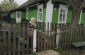 Bronislava T. in front of her house. ©Nicolas Tkatchouk/Yahad - In Unum