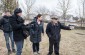 The Yahad team with Iaroslav P. at the execution site at the Jewish cemetery. ©Les Kasyanov/Yahad - In Unum