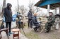 The Yahad team during an interview with a witness at his yard. ©Les Kasyanov/Yahad - In Unum