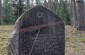 The execution site of 10 Jews of Kaltanėnai, killed in July 1941 in the forest on the outskirts of the town. According to the monument, the massacre was committed by Hitler’s executioners and their local collaborators. ©Kate Kornberg/Yahad - In Unum