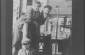 A couple poses on the balcony of their butcher shop, (in the photographer’s words) "taking the May air."  1920s-30s © From the Archives of the YIVO Institute for Jewish Research