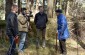 Stanislovas V., born in 1930, with the Yahad team at the Old Jewish cemetery of Svėdasai, where the shooting of Jews was conducted during the German occupation. ©Cristian Monterroso/Yahad - In Unum