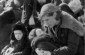 A mother sitting with her children at Lubny, just moments before the executions would begin. © Taken from Yad Vashem Photoarchives