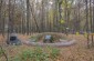 One of the execution mass graves in the woods, where some of the 6,300 Jews were murdered on January 9, 1942. This site is located near former pine grove. ©Les Kasyanov/Yahad - In Unum.