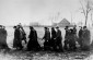 Order Police lead a column of Jews from Ostrów Mazowiecka to the killing site. ©Photo archive, taken from jewishgen.org