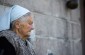 Cecylia L., born in 1933: “I leaned over the fence while my father kept watch for any approaching Germans. I tossed bread to the Jews, and they were already waiting for me.” ©Jordi Lagoutte /Yahad - In Unum