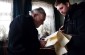 Zenonas S., born in 1928, showing to the Yahad team the list of the Stajėtiškis residents before the war. Most of them were Jewish. ©Kate Kornberg/Yahad - In Unum