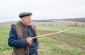 Pavlo S., born in 1930, pointing out the location of the camp. ©Les Kasyanov/Yahad - In Unum