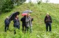 The Yahad team at the execution site with the witness. ©Les Kasyanov/Yahad – In Unum