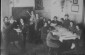 Portrait of a dressmaking class for women at the Trud Professional [trade] School: (inscribed in Yiddish) "Sewing lecture"; (on blackboard in Yiddish)" © From the Archives of the YIVO Institute for Jewish Research