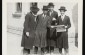 1929. Four young Jewish religious men read a newspaper on a street corner in Kolbuszowa. From right to left: (unknown), Meilech Kirshenbaum, (unknown), Mordechai Israelowicz.  © United States Holocaust Memorial Museum, courtesy of Norman Salsit